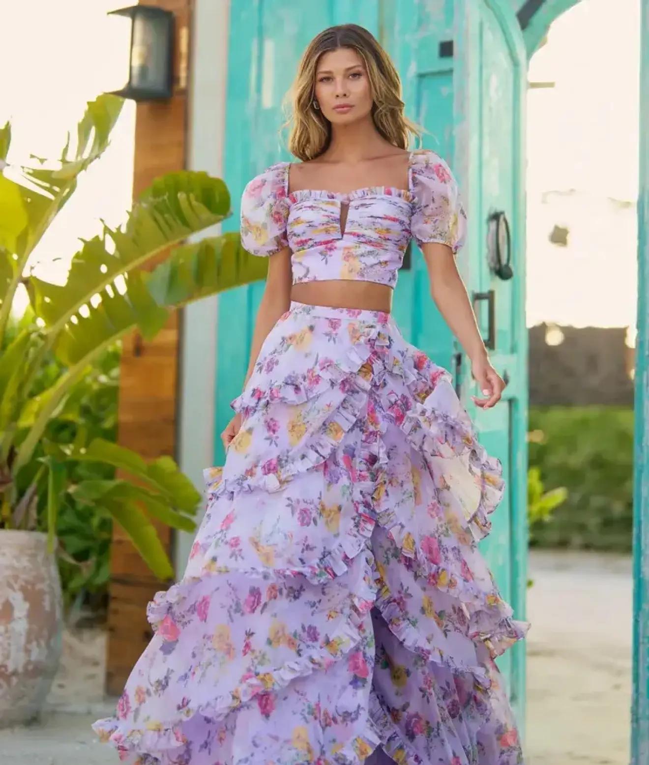Model wearing a purple prom dress