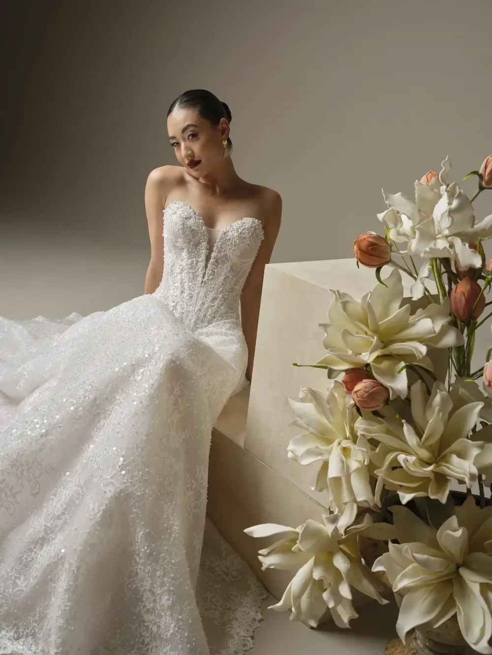 model is wearing a straples bridal gown