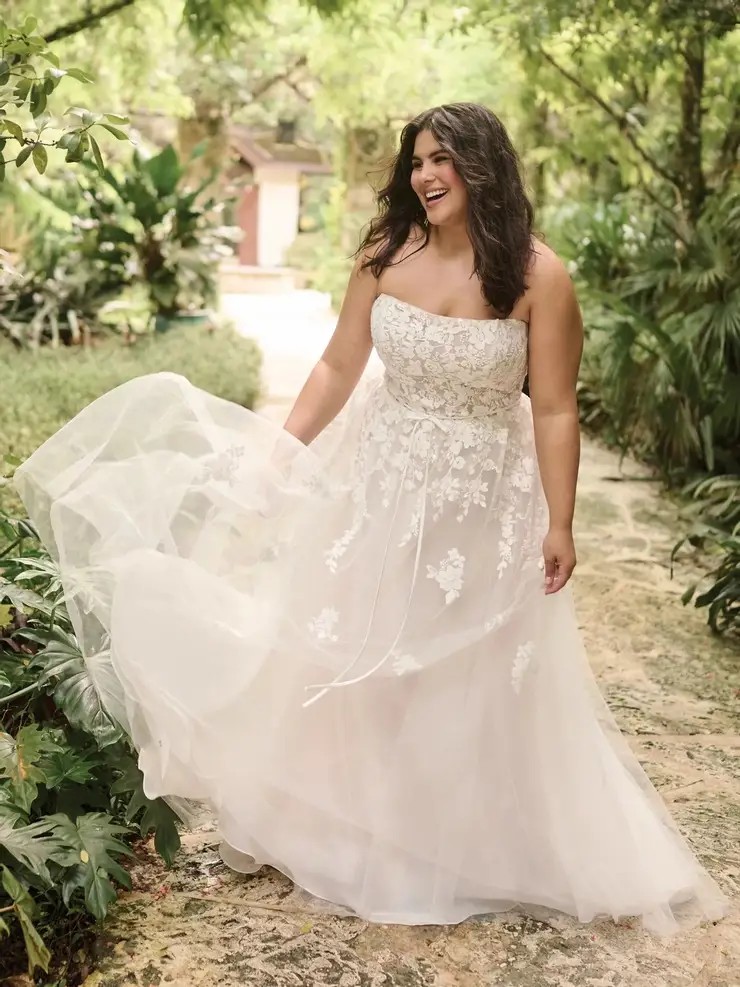 Model wearing a white gown