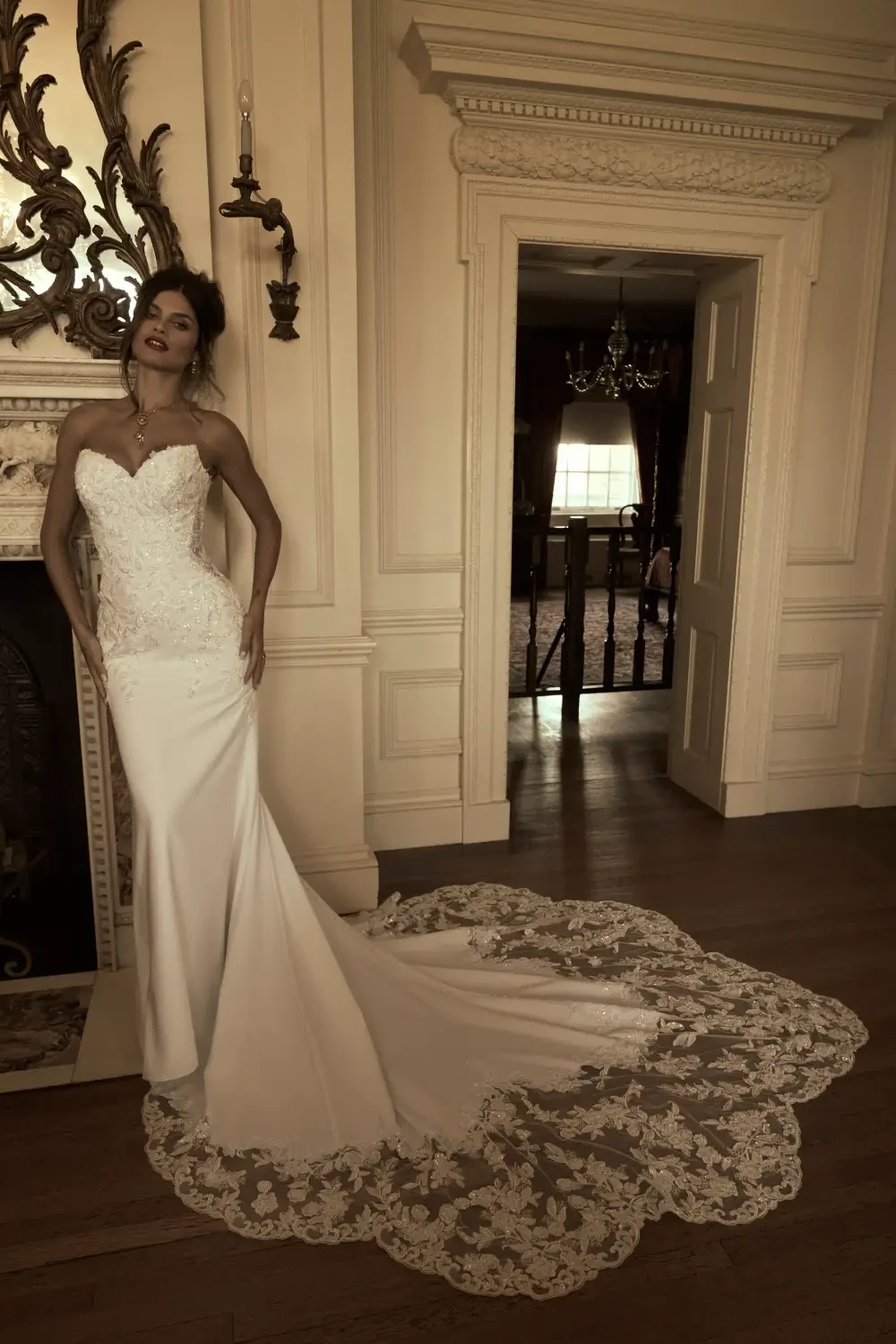 model is wearing a fitted structured strapless wedding dress