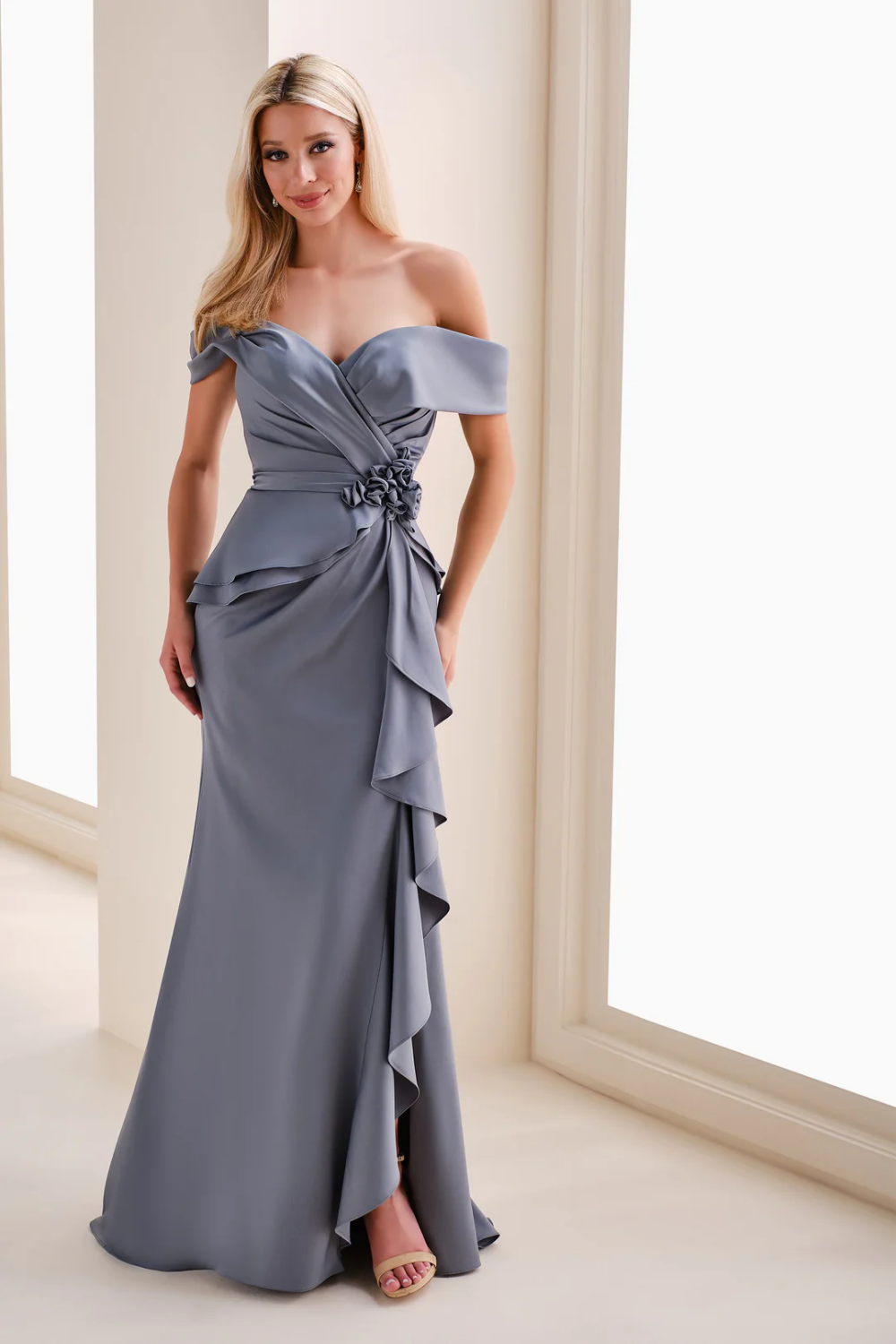 Model wearing a white Mothers gown