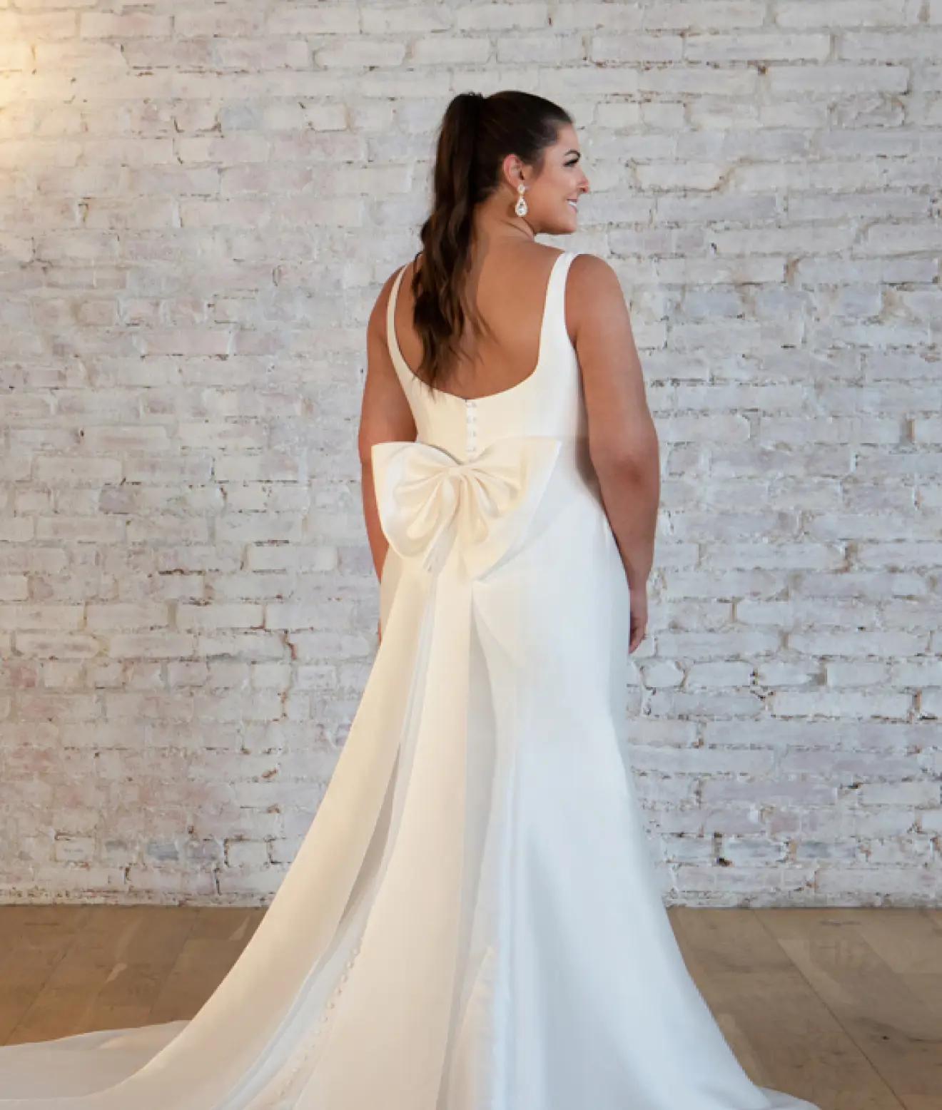 Plus sized model wearing wedding gown