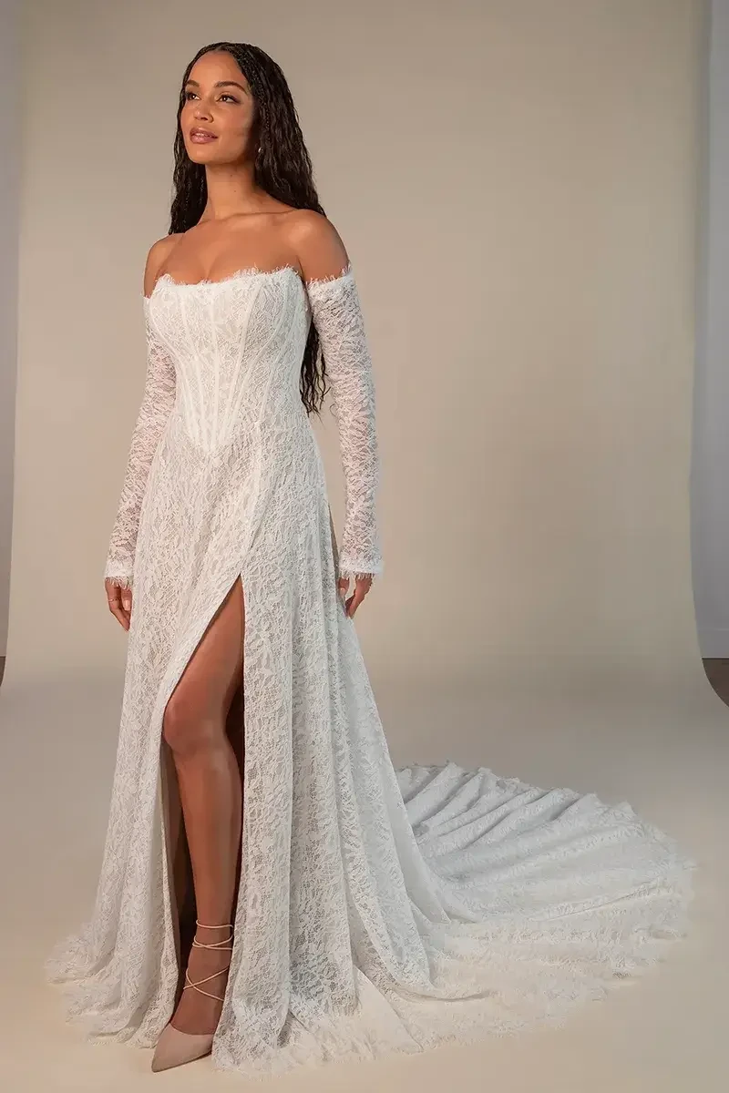 model is wearing an a-line wedding dress with long detachable sleeves