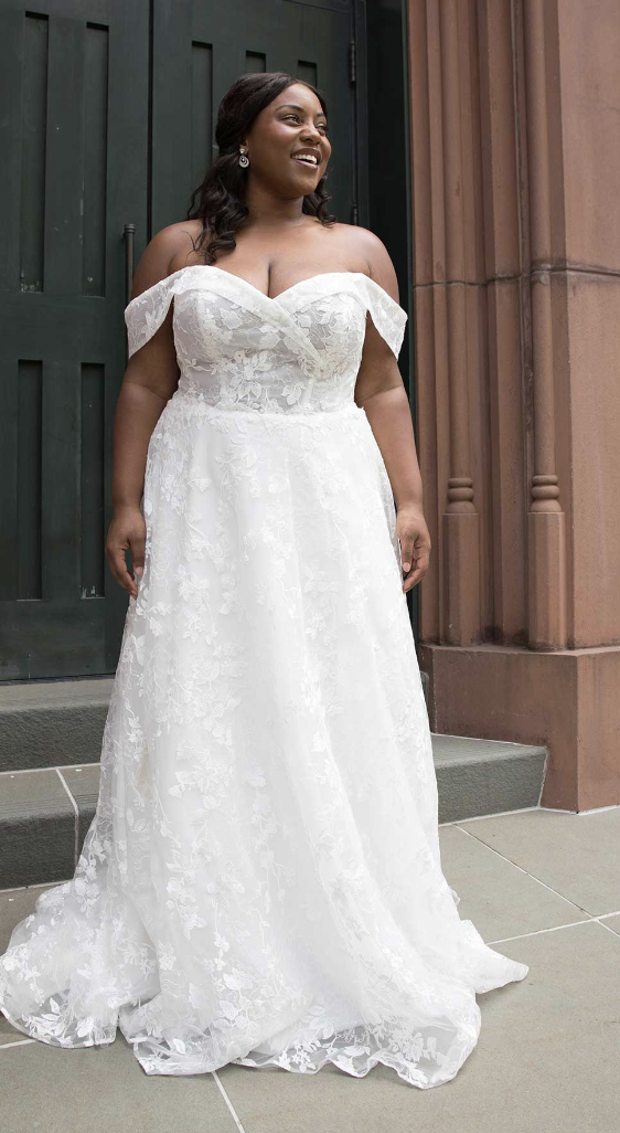Plus sized model wearing bridal gown